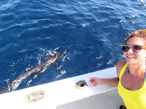 Happy Angler and her first Blue Marlin caught in Key West fishing on charter boat Southbound