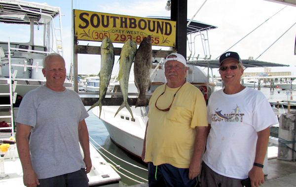 Couple dolphin and a black grouper caught in Key West fishing on charter boat Southbound