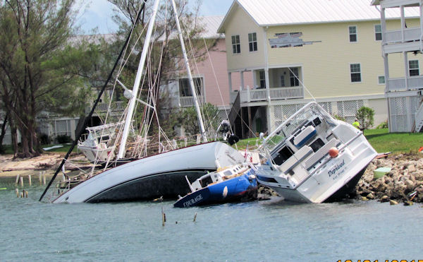 Storm damaged boats in No wake zone in Key West on the way out fishing with charter boat Southbound