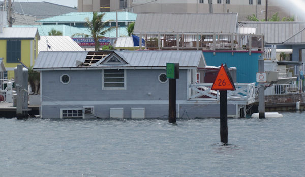 Sunken House boat in No wake zone in Key West on the way out fishing with charter boat Southbound