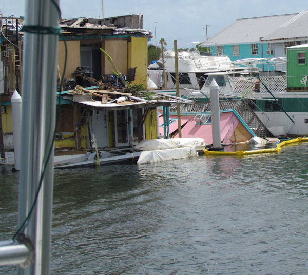 one damaged house boat and one Sunken House boat in No wake zone in Key West on the way out fishing with charter boat Southbound