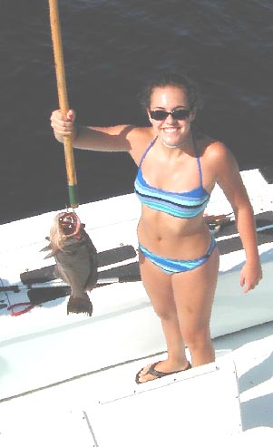 Happy grouper fisherwoman in Key West Florida