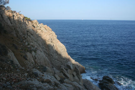 Steep rocks going into the sea on the coast